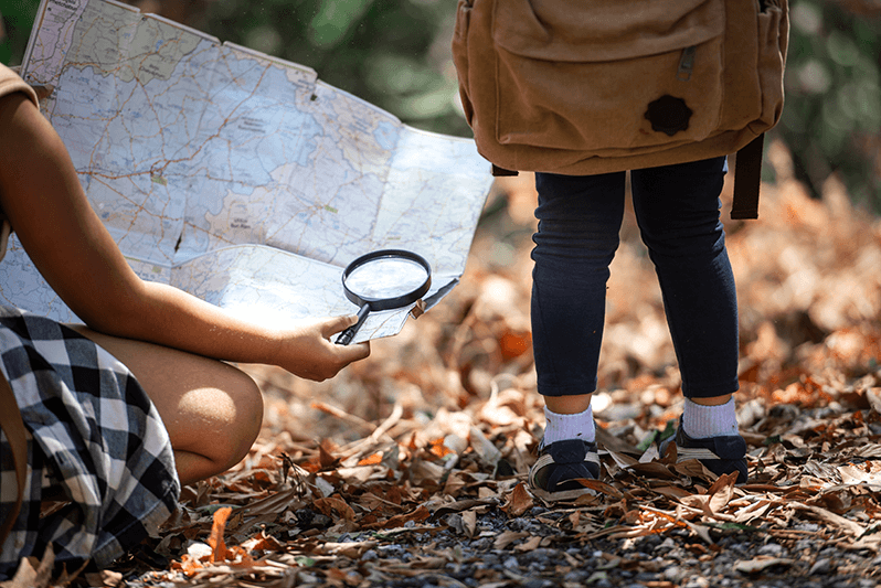 Kids exploring with a magnifying glass